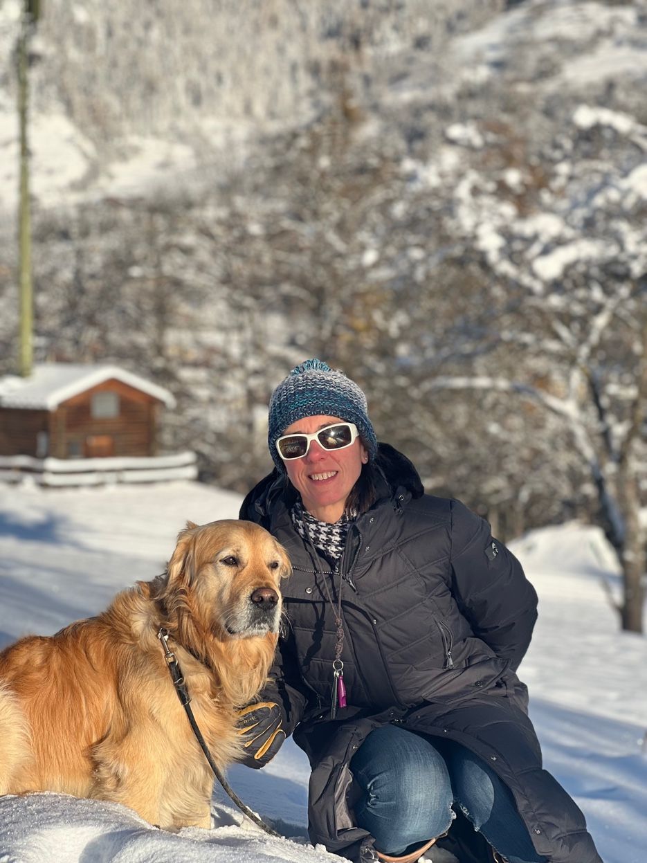 Sarah with her dog in Val des Bagnes snow — contact info@valais.life for relocation help
